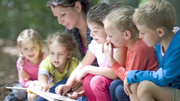 Teacher reading with kids