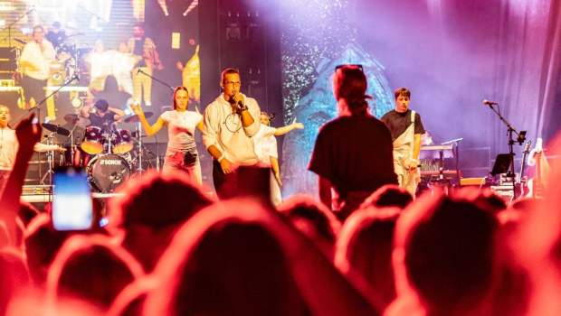 Rapper Cezar rapping on stage of a festival