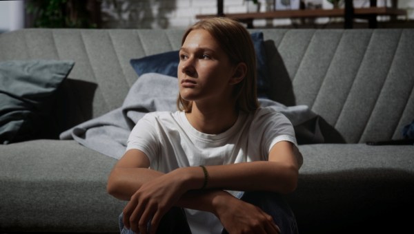 A young person with long hair