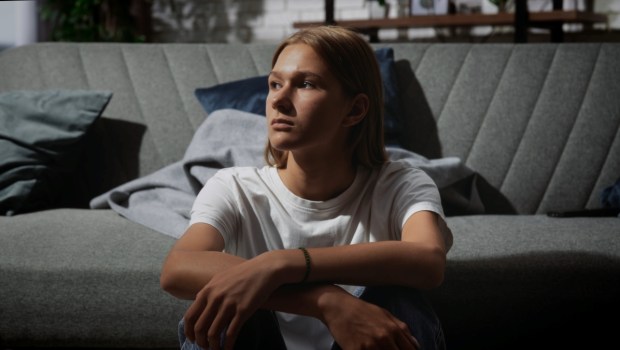 A young person with long hair
