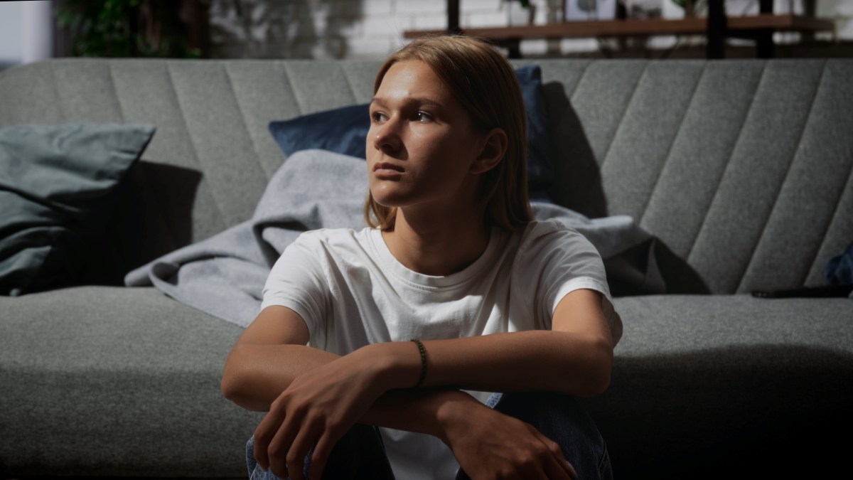 A young person with long hair