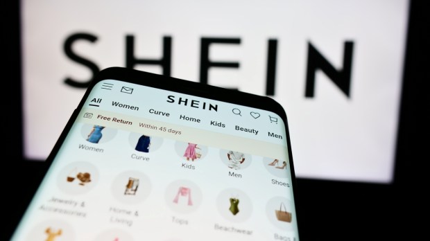 Smartphone with website of fashion e-commerce company Shein