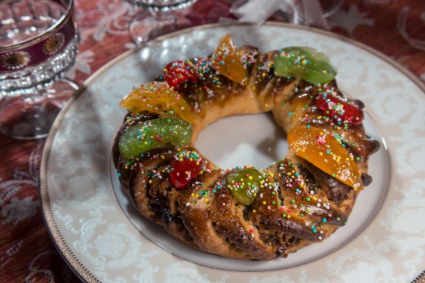 Typical Sicilian Christmas dessert: a colorful Buccellato (also called Cucciddatu) shaped like a donut and decorated with candied fruit and colored sugar balls