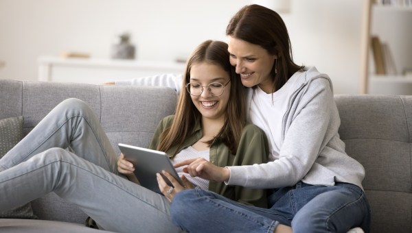 Happy mother and teenager kid girl