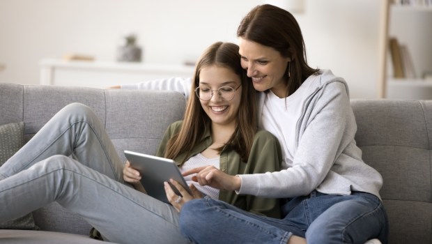 Happy mother and teenager kid girl