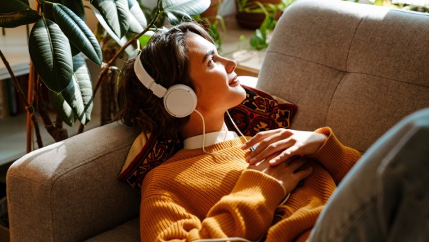 Brunette young woman listening music