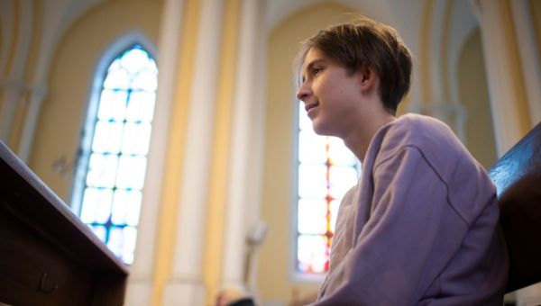 Boy sitting at church