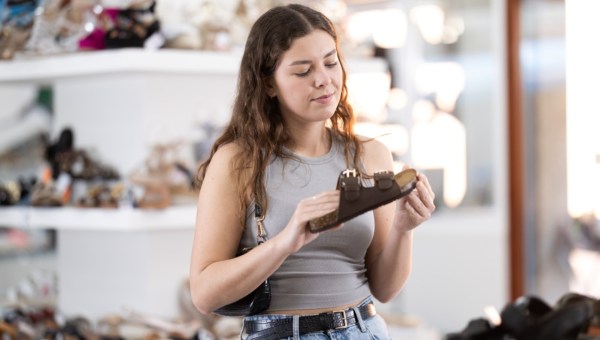 girl picking shoes in the store