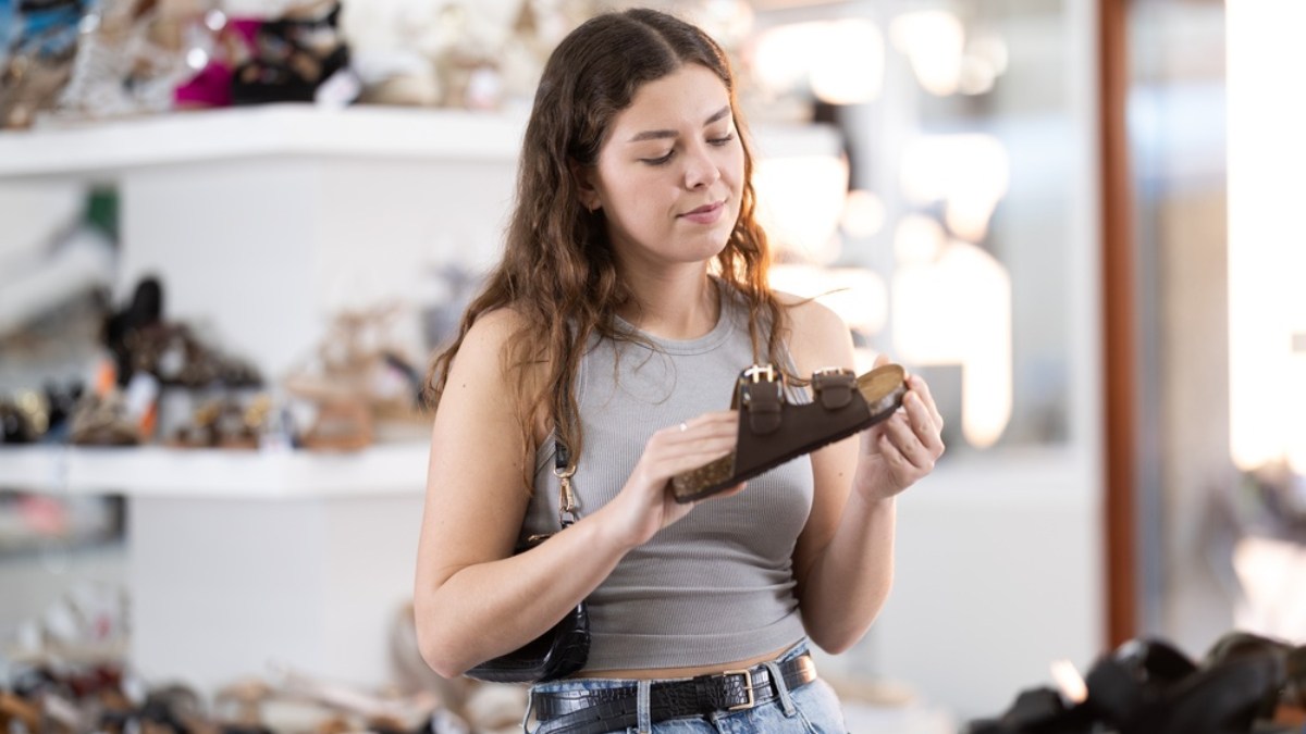 girl picking shoes in the store
